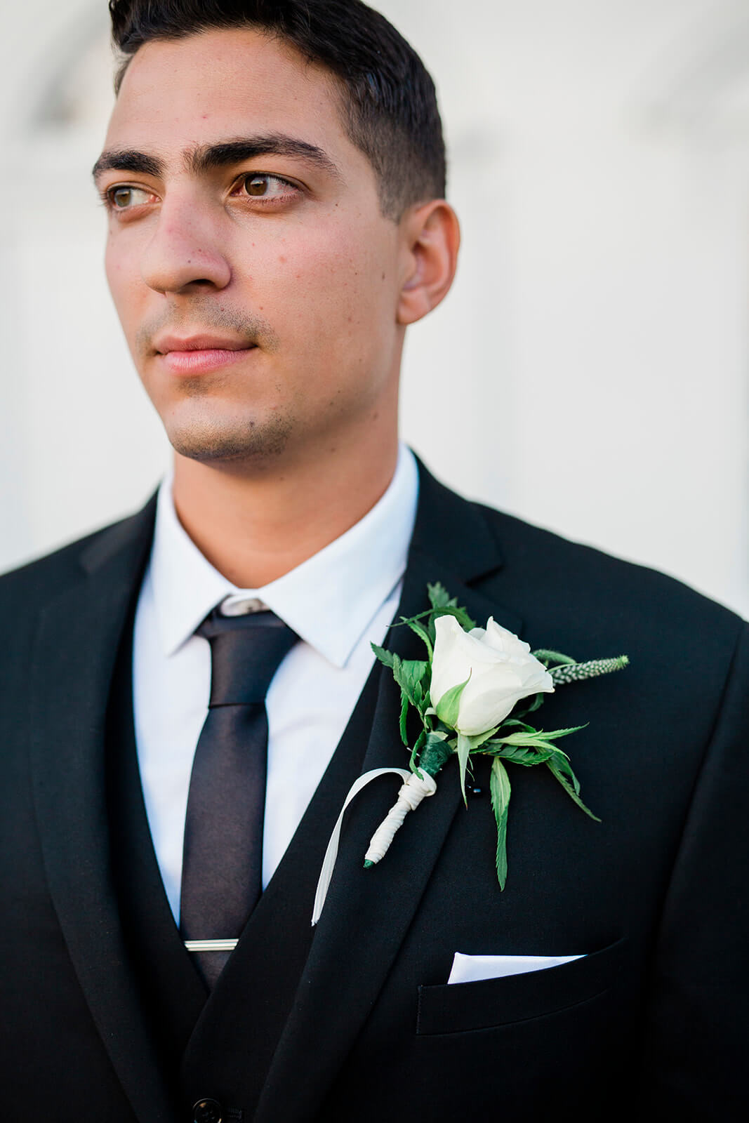 groom, flower, florals, black suit