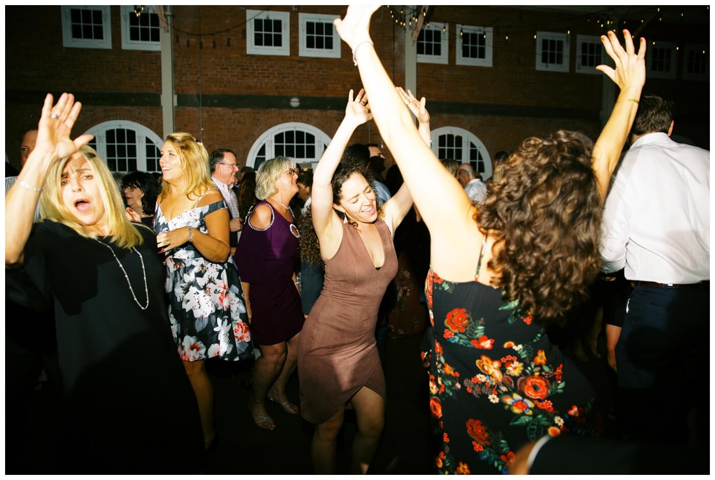 Wedding Reception at BRICK San Diego. Night photos of people dancing and wedding details