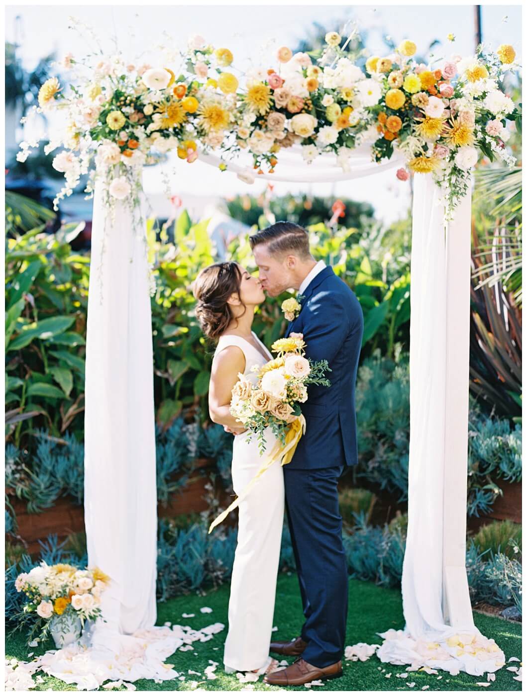 bride and groom first kiss during their san diego airbnb elopement